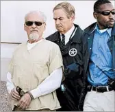  ?? DANNY JOHNSTON/AP FILE ?? Authoritie­s escort Tony Alamo, left, to a waiting police car in 2009. He was convicted on charges that he took underage girls across state lines for sex. He died Tuesday at 82.