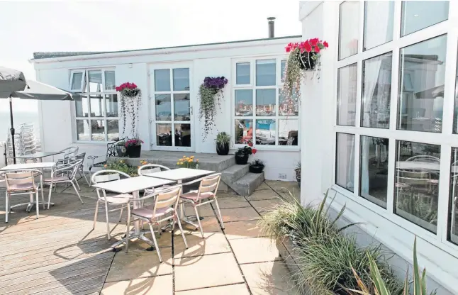  ??  ?? IDEAL LOCATION: The terrace, above; far left, cod with vermouth and parsley sauce and below, from left, cheese souffle, pea mousse and whipped chocolate ganache