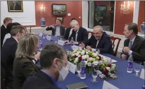  ?? (AP/Andy Wong) ?? U.S. Senate Majority Leader Chuck Schumer (second from right), D-N.Y., speaks next to U.S. Ambassador to China Nicholas Burns (right) during a press roundtable with Schumer and his delegation at the residence of U.S. Ambassador to China, in Beijing on Tuesday.