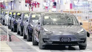  ?? REUTERS ?? Full production capacity at the Shanghai factory is around 85,000 vehicles per month, according to JL Warren Capital LLC.