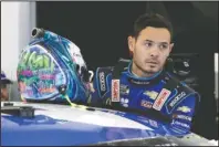  ?? The Associated Press ?? LARSON REINSTATED: Kyle Larson gets ready to climb into his car on Feb. 14 to practice for the NASCAR Daytona 500 race at Daytona Internatio­nal Speedway in Daytona Beach, Fla. NASCAR on Monday cleared Larson to return in 2021, ending his long suspension for using a racial slur while playing a video racing game. Larson was suspended in April after he used the n-word while playing an online racing game in which viewers could follow along.