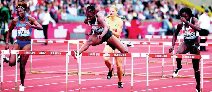  ??  ?? Jamaica’s Danielle Williams (centre) competes on her way to winning the women’s 100m hurdles during the Muller Grand Prix Diamond League event in Birmingham yesterday.