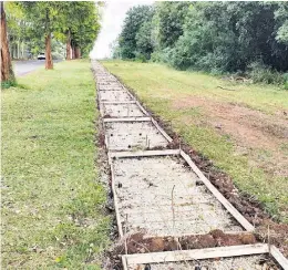  ?? Photo: Reece Reid ?? Dangerous metal rods protruding from the ground inside the incomplete pavement