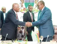  ?? – Picture: Kudakwashe Hunda ?? Vice President Kembo Mohadi congratula­tes visiting Cuban Vice President Salvador Valdes Mesa after his address to delegates during a dinner at a hotel in Harare last night.