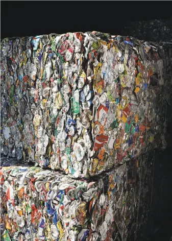  ?? Michael Short / Special to The Chronicle ?? Bales of aluminum cans waits to be shipped overseas at Recology Vallejo. China is requiring materials to be rigorously separated and much cleaner than it had in the past.