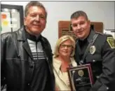  ?? SUBMITTED PHOTO ?? Newtown Sgt. Clinton Cunningham, shown with his parents, Thomas III and Suzanne, with his Officer of the Year Award.