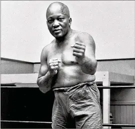  ?? ASSOCIATED PRESS 1932 ?? Boxer Jack Johnson, the first black world heavyweigh­t champion, shows off his moves in New York City in 1932. Johnson had a 73-13 record in the ring.