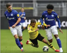  ??  ?? Dortmund’s Thorgan Hazard was forced off with cramp