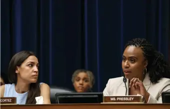  ?? AP ?? DYNAMIC DUO: Rep. Alexandria Ocasio-Cortez (D-N.Y.), left, listens as Rep. Ayanna Pressley (D-Mass.) speaks about the treatment of immigrant children at the Mexican border in Washington, D.C., on Wednesday.