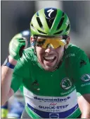  ??  ?? The Associated Press
Britain’s Mark Cavendish, wearing the best sprinter's green jersey, celebrates as he crosses the finish line to win the 13th stage of the Tour de France cycling race on Friday.