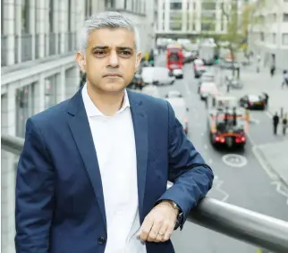  ??  ?? Mayor of London Sadiq Khan poses following an environmen­t and emissions policy launch event outlining plans to place a levy on the most polluting vehicles in London on Tuesday. (Reuters)