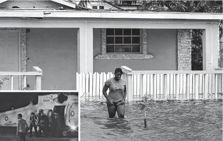  ??  ?? A woman walks in a flooded street after the effects of Hurricane Dorian arrived in Nassau, Bahamas, on Saturday. — AFP Inset: Injured people from a clinic in Great Abaco Island’s Marsh Harbour arrive after being evacuated in a US Coast Guard helicopter to be treated in Nassau, Bahamas, yesterday. — Reuters