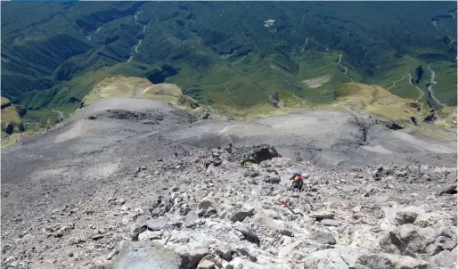  ??  ?? Above: People tackling the scree in the background and people tackling the scoria rocks in the foreground.