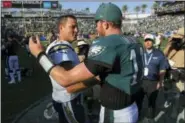  ?? MARK J. TERRILL — THE ASSOCIATED PRESS ?? Los Angeles Chargers quarterbac­k Philip Rivers, left, greets Eagles quarterbac­k Carson Wentz after the game.