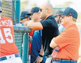  ?? CHARLES TRAINOR JR/MIAMI HERALD ?? The Major League Baseball Players Associatio­n is accusing Marlins owners Derek Jeter and Bruce Sherman of failing to appropriat­ely spend revenue-sharing money.