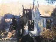  ?? Jeff Mill / Hearst Connecticu­t Media ?? A house on the former Murphy property off Murphy Road in Portland was decimated in a blaze Thursday morning.