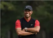  ?? LEE JIN-MAN - THE ASSOCIATED PRESS ?? Tiger Woods of the United States smiles during a winner’s ceremony after winning the Zozo Championsh­ip PGA Tour at the Accordia Golf Narashino country club in Inzai, east of Tokyo, Japan, Monday, Oct. 28, 2019.