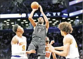  ?? AFP ?? Kevin Durant (#7) of the Brooklyn Nets shoots the ball as RJ Barrett (#9) and Jericho Sims (#45) of the New York Knicks defend during the first half at Barclays Centre on Sunday.