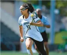  ?? LARRY FRENCH/LOYOLA ATHLETICS ?? Loyola Maryland’s Sydni Black carries the ball during the Patriot League Tournament final against Army West Point last season.