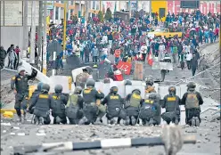  ?? AFP ?? Demonstrat­ors clash with riot police at the Anashuayco bridge in Arequipa, Peru, during a protest against the government of President Dina Boluarte and to demand her resignatio­n, on Thursday. Some 1,000 protesters tried to storm the airport, but were repelled by police firing tear gas, local television showed. Thousands also marched through the capital city Lima in a large rally punctuated by clashes with police, with the nationwide death toll rising to 45.