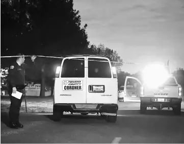  ??  ?? A Tehama County Coroner’s van enters the Rancho Tehama Elementary school grounds after a shooting, in Rancho Tehama, California. — AFP photo