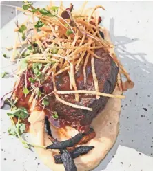  ?? MICHAEL SEARS / MILWAUKEE JOURNAL SENTINEL ?? Braised short rib with parsnip, charred carrot and haystack potatoes is one of Belfre Kitchen’s large plates.