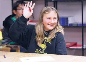  ?? PHOTOS BY JANE PHILLIPS/FOR THE NEW MEXICAN ?? LEFT: Hazel Blais, 11, raises her hand during a world language demo class at Desert Academy’s open house. The 11-year-old Acequia Madre Elementary School student has visited a number of private and charter schools but is glad her parents will get the...