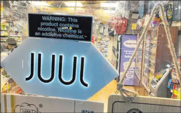  ?? Ted Shaffrey The Associated Press file ?? In a deal announced Tuesday, Juul Labs will pay nearly $440 million to settle a twoyear investigat­ion by 33 states into the marketing of its high-nicotine vaping products.