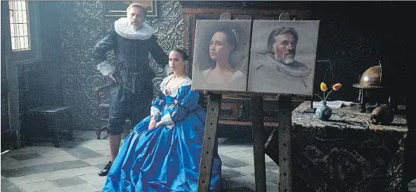  ?? EONE FILMS ?? Christoph Waltz, left, and Alicia Vikander star in the upcoming movie Tulip Fever, a romance set in Amsterdam in 1634.