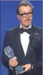  ?? PHOTO: KEVIN WINTER/GETTY IMAGES/AFP ?? Gary Oldman accepts Best Actor for Darkest Hour