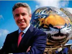  ??  ?? Embraer’s John Slattery with the Profit Hunter at the Singapore Airshow