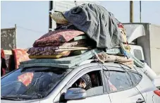  ?? /Reuters ?? IsraelHama­s war: Palestinia­ns, who fled Khan Younis due to Israel’s ground operation, arrive in a car in Rafah in southern Gaza.