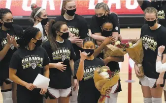  ?? Jeff Chiu / Associated Press ?? Stanford guard Anna Wilson, foreground, gestures in front of teammates as she and other senior players are honored after Stanford defeated Cal at Maples Pavilion on Sunday.