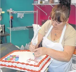  ?? DAVE STEWART/THE GUARDIAN ?? Shelley Deveaux has been baking and decorating cakes for Buns and Things for the past 15 years and is now getting her own space in the soon-to-open Cakes by Buns and Things.