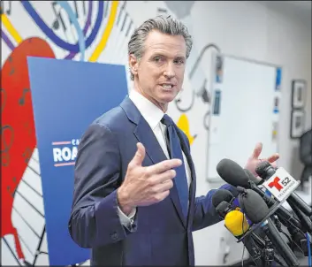  ?? Marcio Jose Sanchez The Associated Press ?? Gov. Gavin Newsom, facing removal from office in a recall election, fields questions after a Tuesday rally where he signed the California Comeback Plan relief bill.