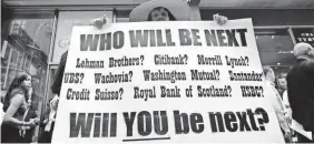  ?? MARY ALTAFFER/AP ?? Protest in front of Lehman Bros. on Sept. 15, 2008, in New York.