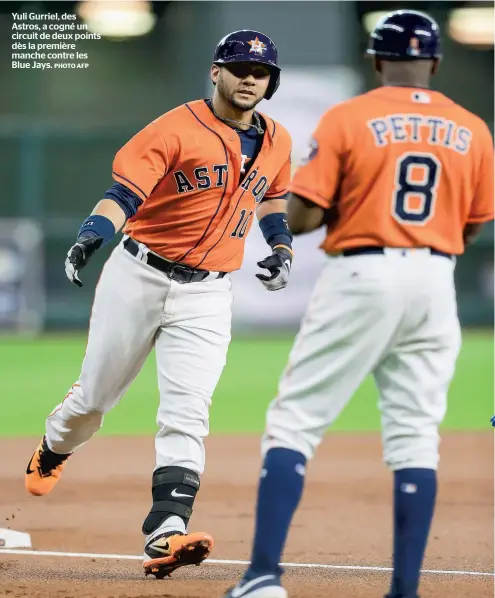  ?? PHOTO AFP ?? Yuli Gurriel, des Astros, a cogné un circuit de deux points dès la première manche contre les Blue Jays.