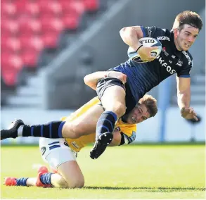  ??  ?? Ruaridh Mcconnochi­e attempts to tackle AJ Macginty