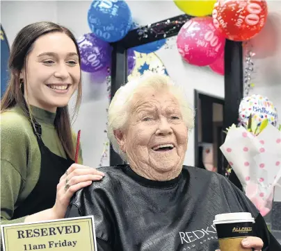  ?? PHOTO: PETER MCINTOSH ?? Birthday brush . . . Eileen Pratt (100) has her weekly hair styling with Hair Co hairdresse­r Tansy Mogensen in Mosgiel yesterday. Inset: A plaque reserving Mrs Pratt’s seat at the salon every Friday at 11am.