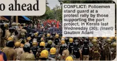  ?? ?? CONFLICT: Policemen stand guard at a protest rally by those supporting the port project, in Kerala last Wednesday (30); (inset) Gautam Adani