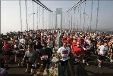  ?? RICHARD DREW — ASSOCIATED PRESS FILE ?? In a Nov. 6, 2005, photo, runners cross the upper level of the Verrazano Bridge at the start of the 36th New York City Marathon.