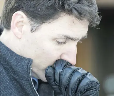  ?? JONATHAN HAYWARD / THE CANADIAN PRESS ?? Prime Minister Justin Trudeau pauses as he answers questions on a visit to Vancouver on Monday.