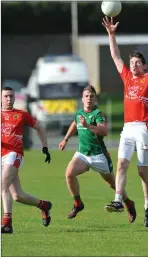  ??  ?? Donal Begley rises highest for Naomh