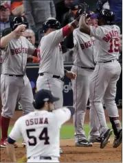  ?? LYNNE SLADKY — THE ASSOCIATED PRESS ?? Boston’s Jackie Bradley Jr., right, celebrates after hitting a grand slam off Houston relief pitcher Roberto Osuna.