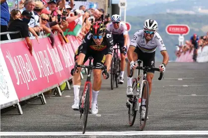  ??  ?? Wout Van Aert out-sprints Julian Alaphilipp­e to win stage four of the Tour of Britain and take the overall lead. Photograph: Alex Livesey/ Getty Images