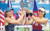  ?? AFP ?? Martina Hingis (left) and YungJan Chan of Taiwan.