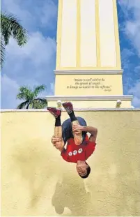  ?? MARK RANDALL/STAFF PHOTOGRAPH­ER ?? Brad Short, of Boca Raton, back flips off a wall as part of his Parkour regimen. He started the extreme sport at 14.