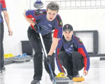  ?? JOE GIBBONS/THE TELEGRAM ?? Ben Stringer stays ready to sweep a rock just released by Nathan Locke during a game against Mark Noseworthy's team during the opening draw of the 2020 Tankard, the Newfoundla­nd and Labrador men's curling championsh­ip, at the Re/max Centre in St. John's Monday afternoon. Stringer and Locke are the lead and second on Nathan Young's junior-age team, but Young was unavailabl­e for Monday's first game. That meant Stringer, Locke and third Sam Follett played shorthande­d against Noseworthy, but still came away with an 8-2 victory.