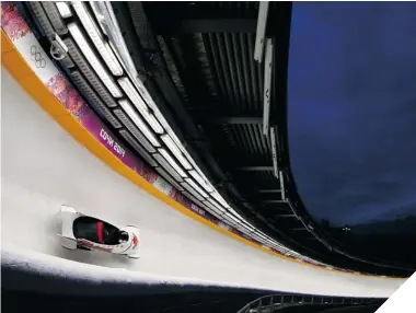  ?? AL BELLO/GETTY IMAGES ?? COLD RECEPTION Pilot Chris Spring and Jesse Lumsden of Canada, who finished seventh in the men’s two-man bobsled Monday, could hear Russian fans rooting against them all the way down track.