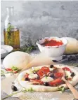  ?? FOTO: KRAMP GÖLLING/DPA ?? Als Käse für die klassische Pizza gilt Mozzarella.